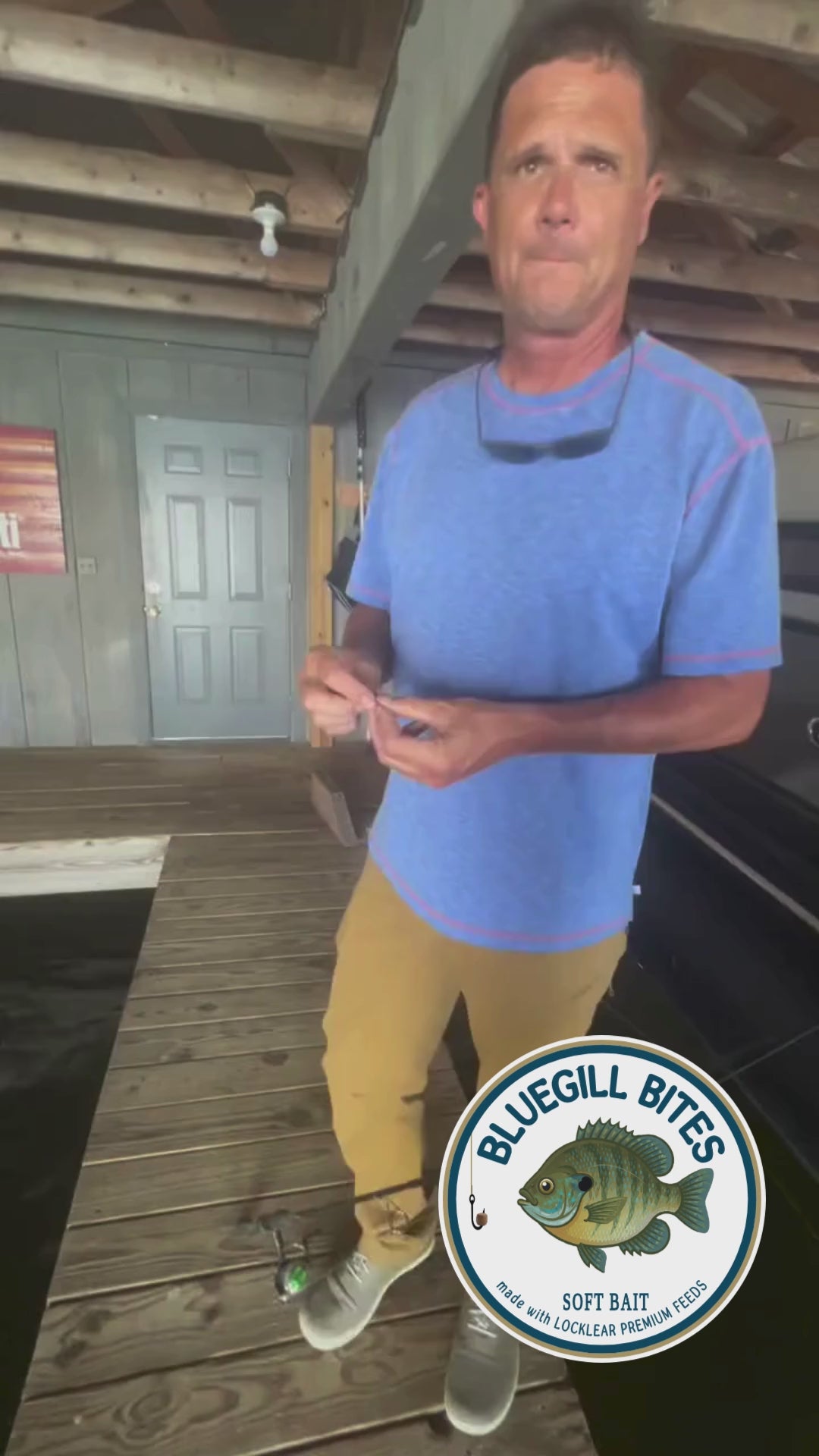 Man fishing inside a boathouse using Bluegill Bites.